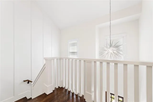 a bathroom with a granite countertop sink a large mirror a shower and a bathtub