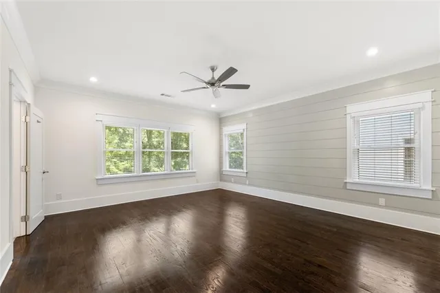 a bathroom with double sink and a large mirror
