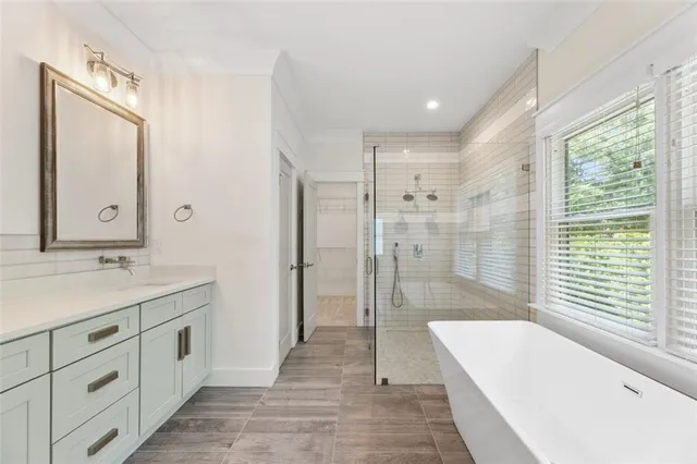 a bathroom with a bathtub and shower