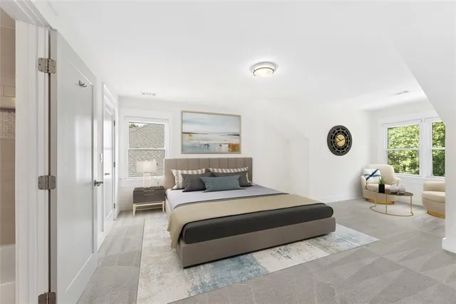 a view of a livingroom with furniture and windows