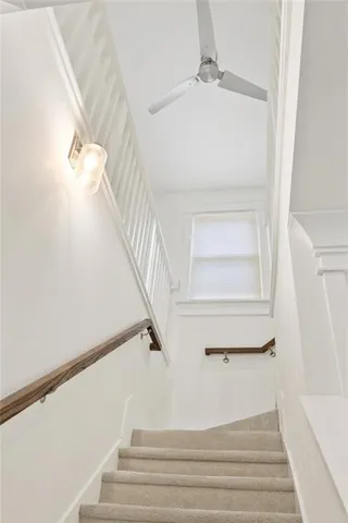 a bathroom with a sink toilet tub vanity and shower