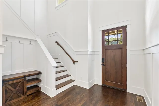 a view of an entryway with wooden floor