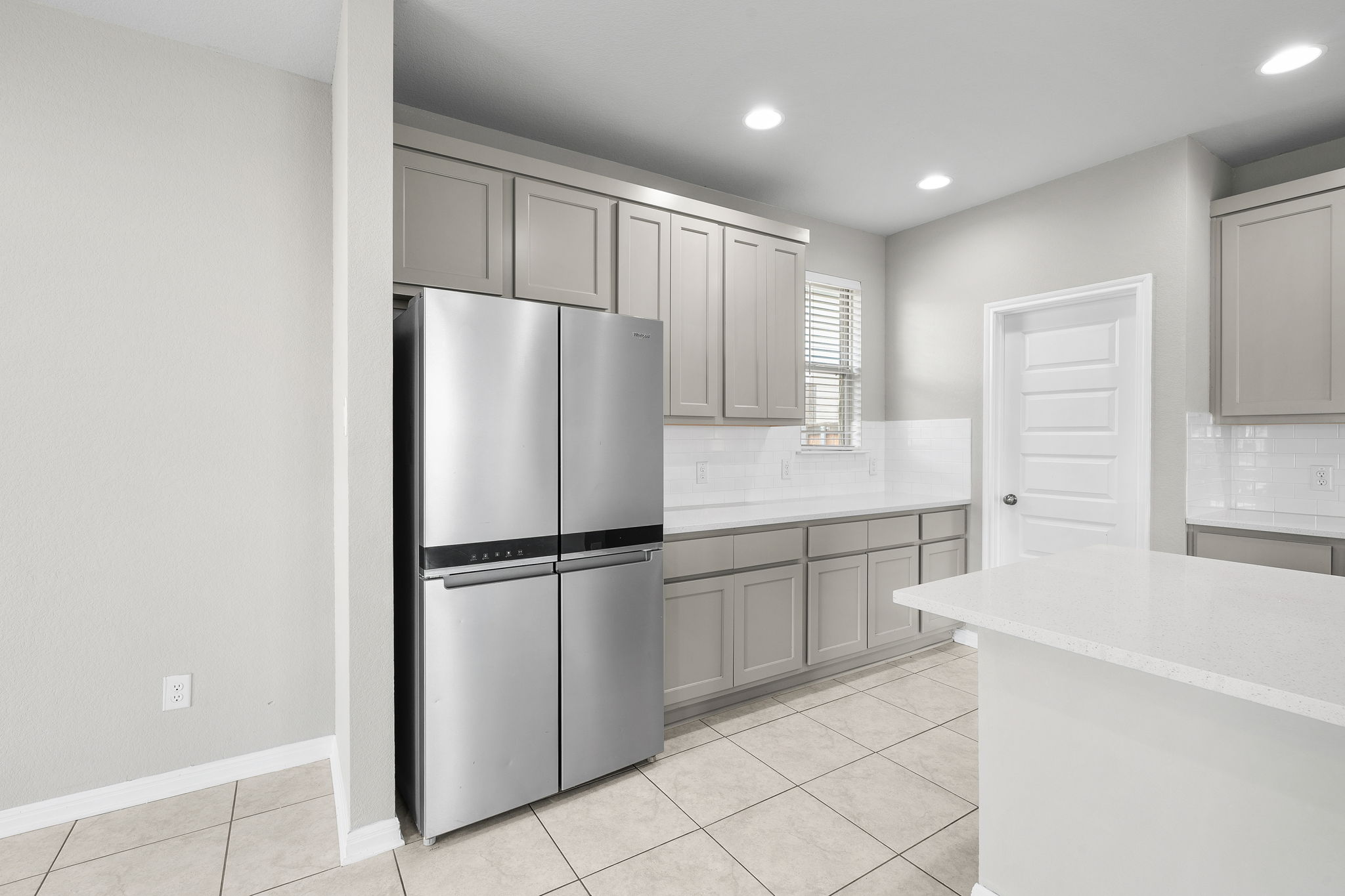 313 Mclintock Road Jarrell, TX 76537 - Photo 19 of 40 A well-appointed kitchen features stainless steel appliances, ample cabinetry, and crisp white countertops.