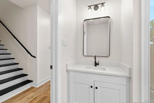 a bathroom with a sink and a mirror