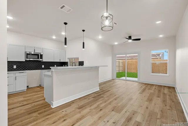 a view of kitchen with window and wooden floor