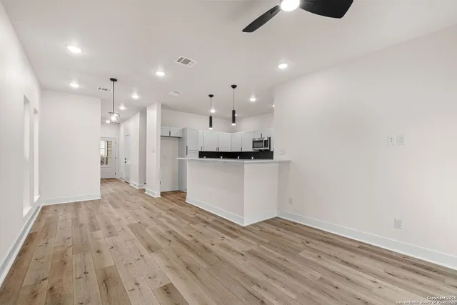 a view of kitchen with wooden floor