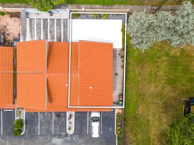 a street view of a building with wooden fence