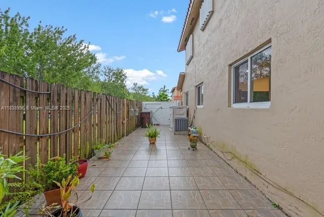 a view of an entryway with wooden fence
