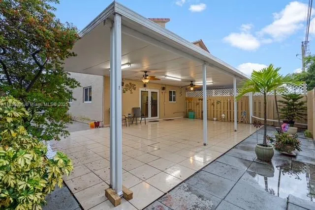 a lobby with a patio and a garden