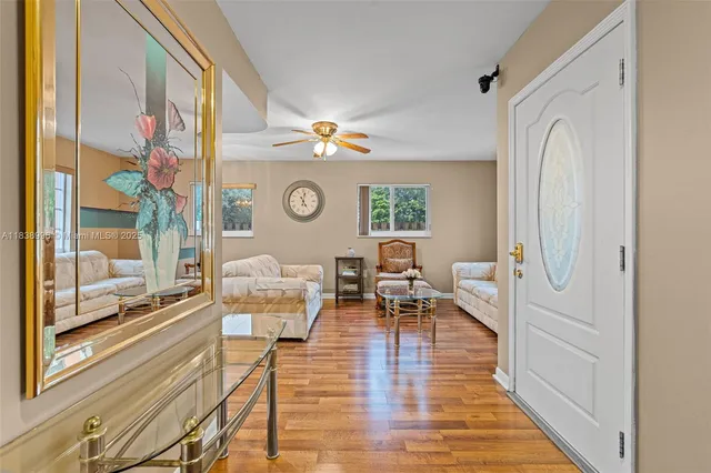 a view of a livingroom with furniture and window