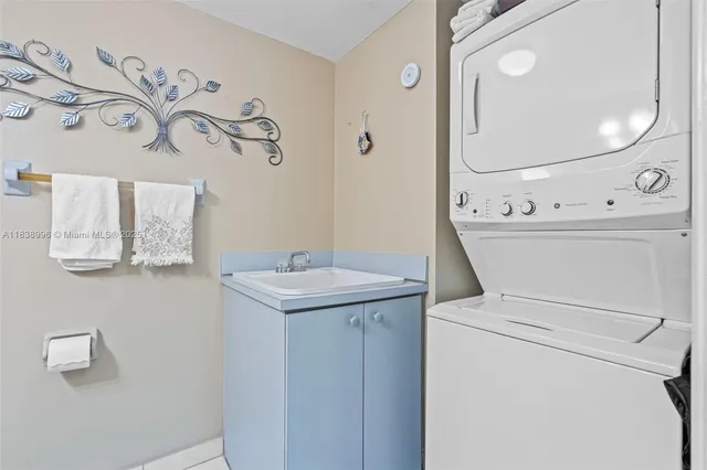 a bathroom with a sink mirror vanity and toilet