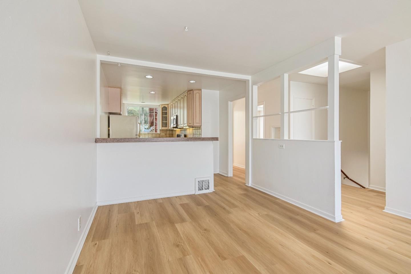931 Hillside Boulevard Daly City, CA 94014 - Photo 11 of 63 a view of a kitchen cabinets and wooden floor