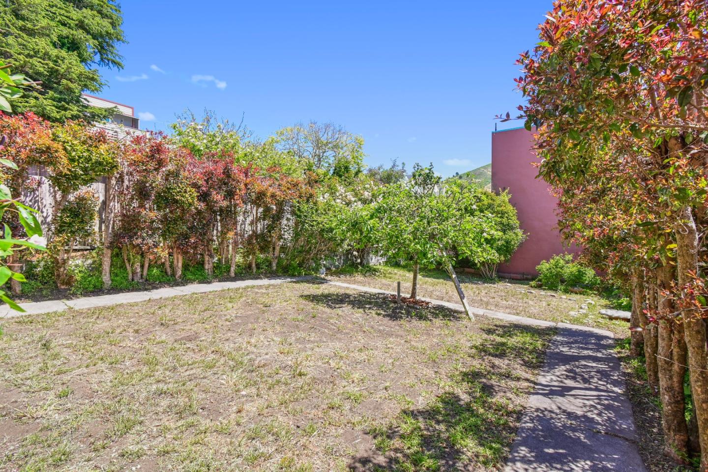 931 Hillside Boulevard Daly City, CA 94014 - Photo 50 of 63 a backyard of a house with lots of green space