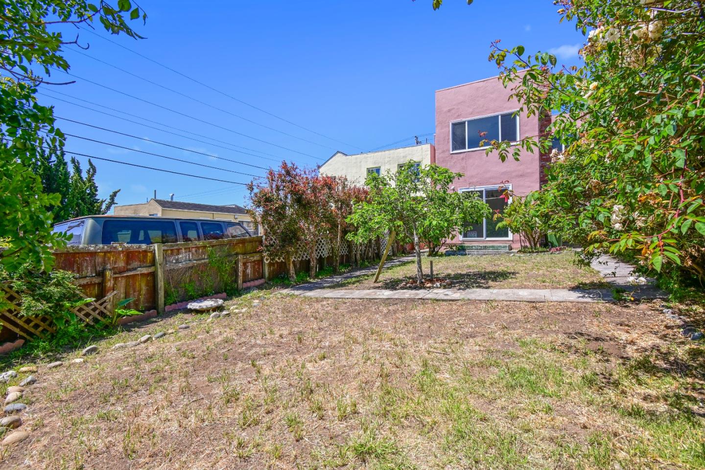 931 Hillside Boulevard Daly City, CA 94014 - Photo 52 of 63 a backyard of a house with plants and tree with yard