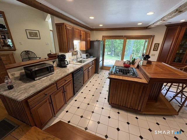 40 Looking Glass Hill Road Litchfield, CT 06750 - Photo 14 of 33 a kitchen with stainless steel appliances a stove a sink a refrigerator and cabinets