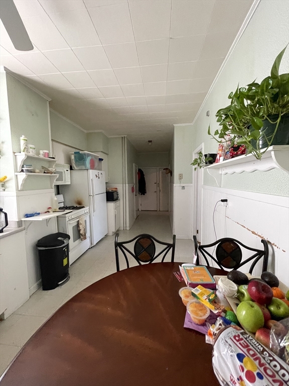 a workspace with furniture and a flat screen tv