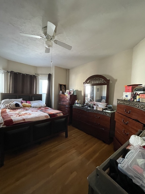 109 Wordsworth Street, Unit 2 Boston, MA 02128 - Photo 11 of 16 a bed room with a bed and a mirror