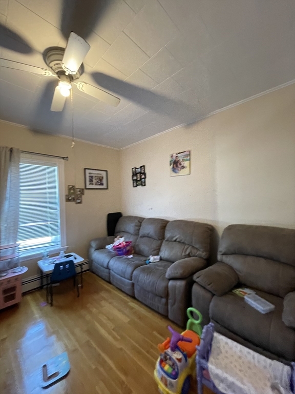 109 Wordsworth Street, Unit 2 Boston, MA 02128 - Photo 13 of 16 a living room with furniture and a window