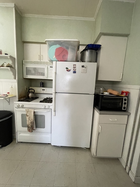109 Wordsworth Street, Unit 2 Boston, MA 02128 - Photo 3 of 16 a white refrigerator freezer sitting in a kitchen