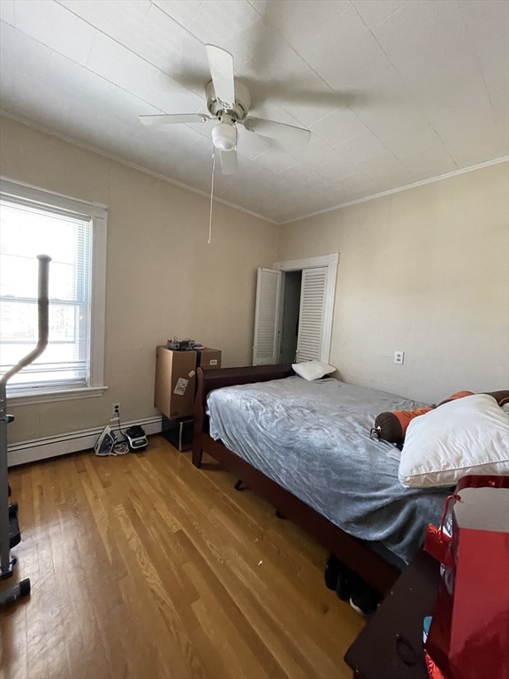 109 Wordsworth Street, Unit 2 Boston, MA 02128 - Photo 8 of 16 a bedroom with bed and window