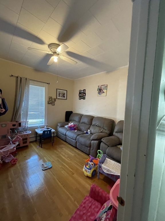 109 Wordsworth Street, Unit 2 Boston, MA 02128 - Photo 9 of 16 a living room with furniture and wooden floor