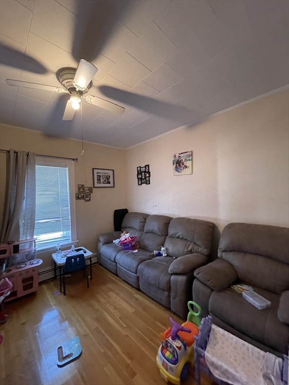 109 Wordsworth Street, Unit 2 Boston, MA 02128 - Photo 10 of 16 a living room with furniture and a window