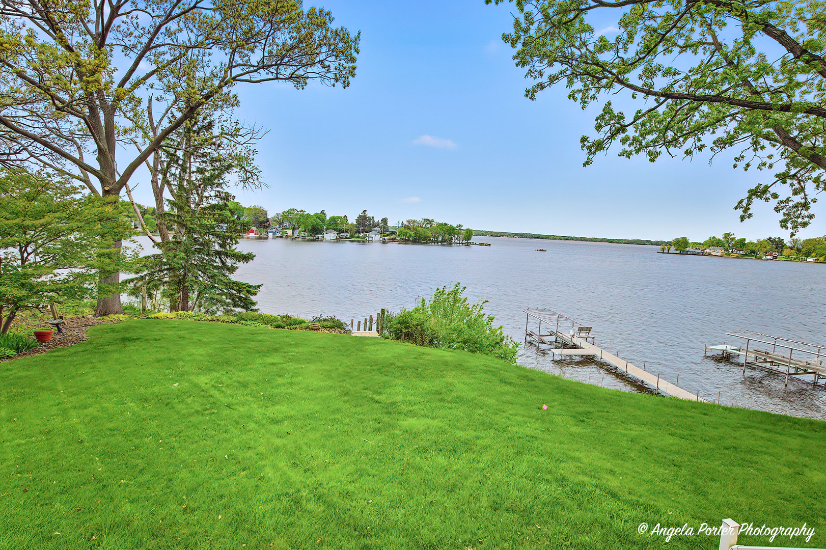 35166 Lake Shore Road Ingleside, IL 60041 - Photo 30 of 39 a view of a lake with houses in the back
