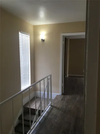 a view of entryway and hall with a window