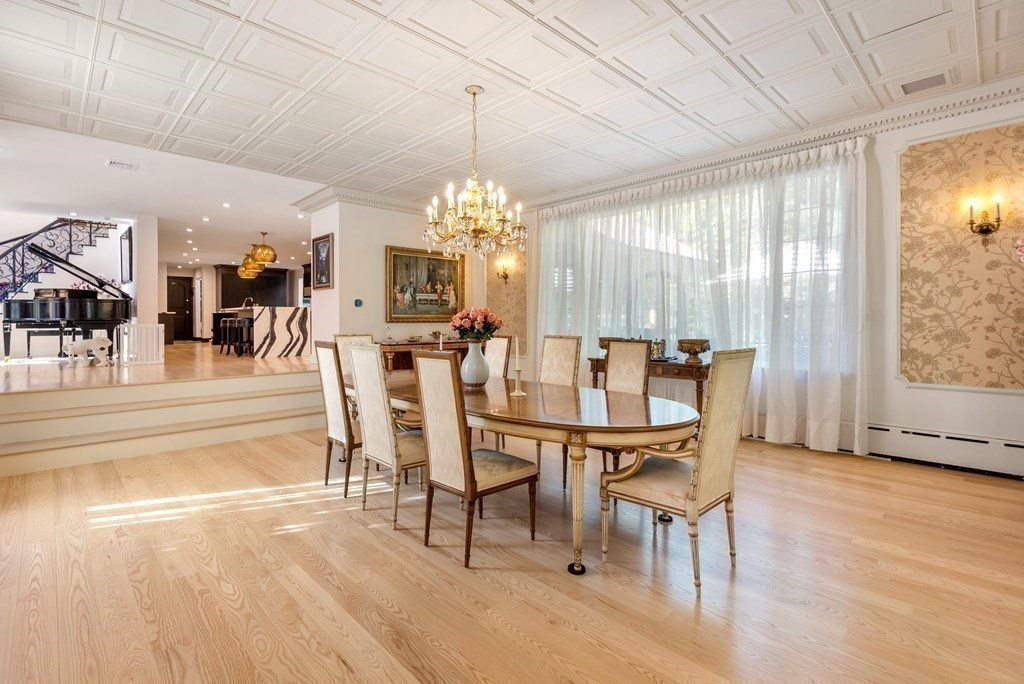 55 Scotch Pine Road Weston, MA 02493 - Photo 12 of 39 a view of a dining room with furniture and chandelier