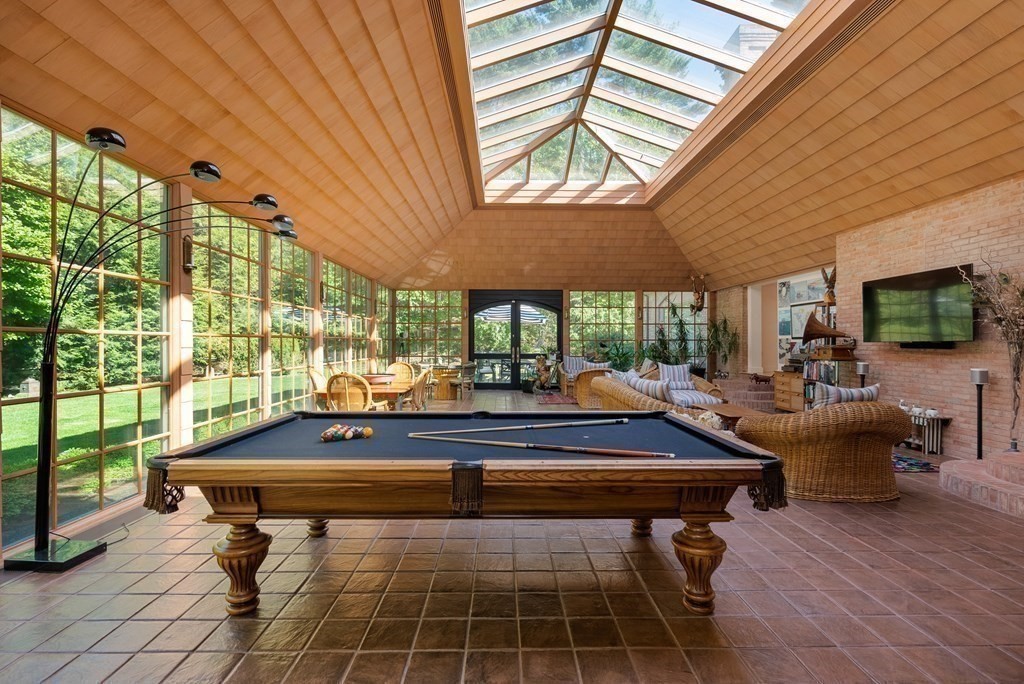 55 Scotch Pine Road Weston, MA 02493 - Photo 15 of 39 a outdoor space with patio lots of furniture and wooden floor