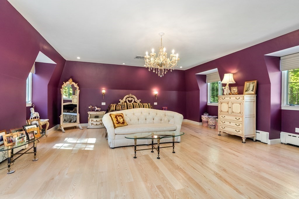 55 Scotch Pine Road Weston, MA 02493 - Photo 18 of 39 a living room with furniture a chandelier and a dining table