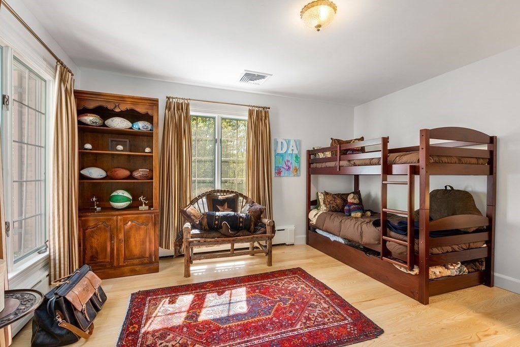55 Scotch Pine Road Weston, MA 02493 - Photo 23 of 39 a bedroom with furniture and a window