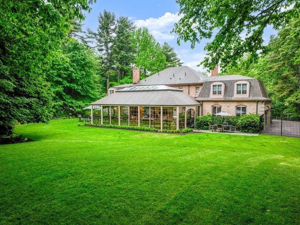 55 Scotch Pine Road Weston, MA 02493 - Photo 36 of 39 a front view of a house with a yard