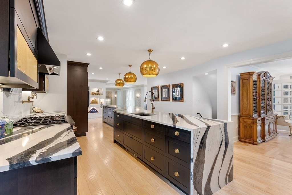 55 Scotch Pine Road Weston, MA 02493 - Photo 6 of 39 a kitchen with stainless steel appliances granite countertop a sink stove and refrigerator