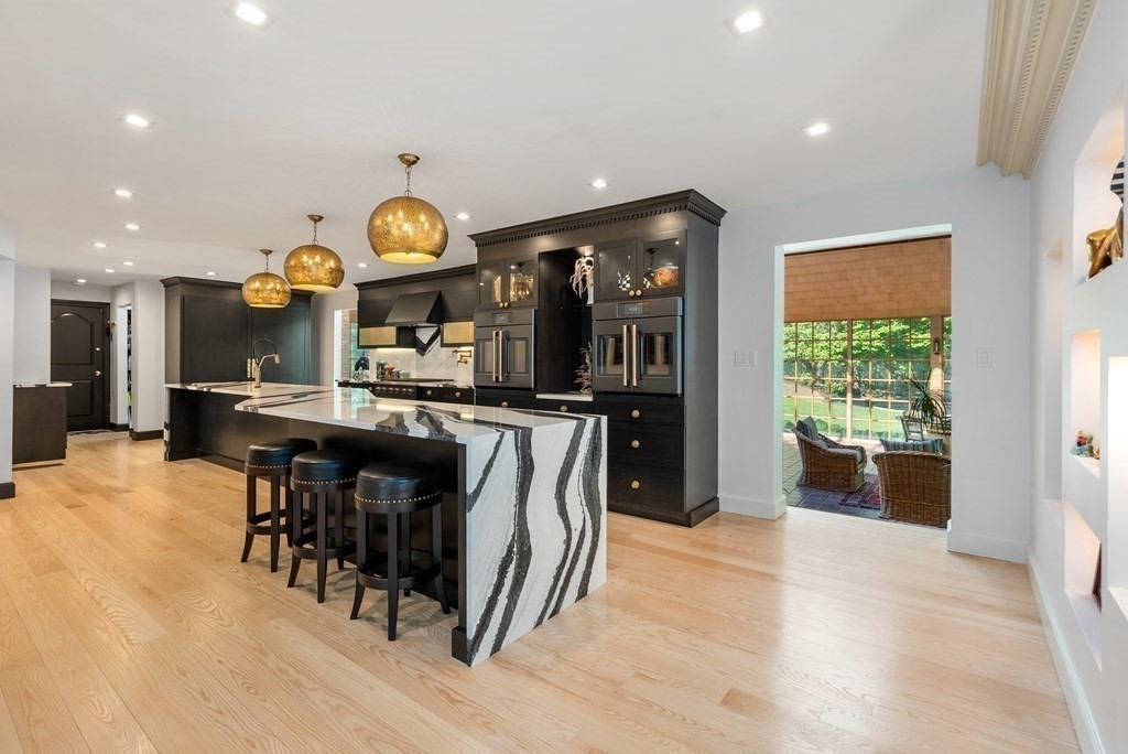 55 Scotch Pine Road Weston, MA 02493 - Photo 7 of 39 a kitchen with a table and chairs in it