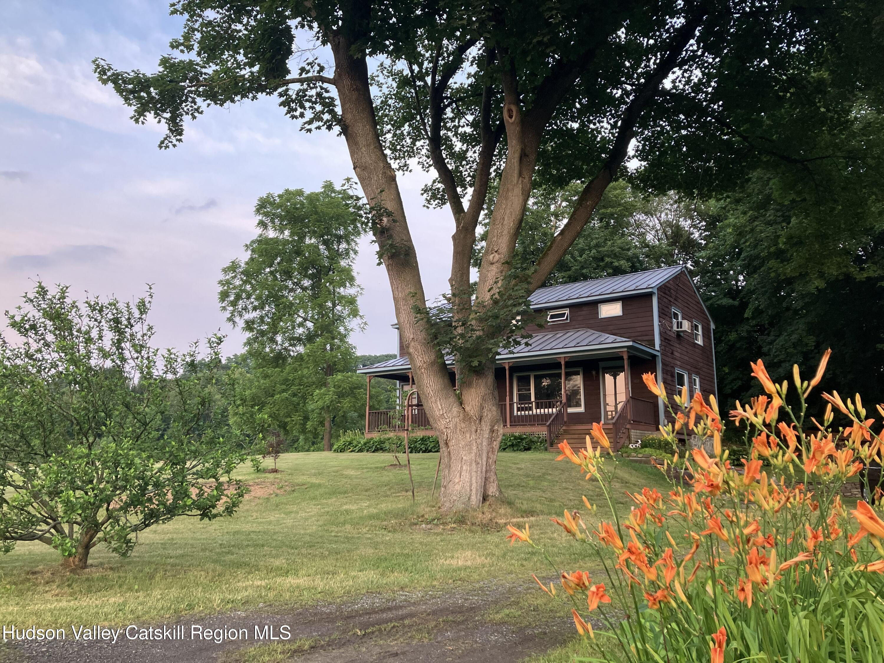 1492 County Road Copake, NY 12516 - Photo 2 of 34 a front view of a house with a yard