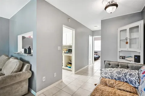 a bedroom with furniture and a potted plant