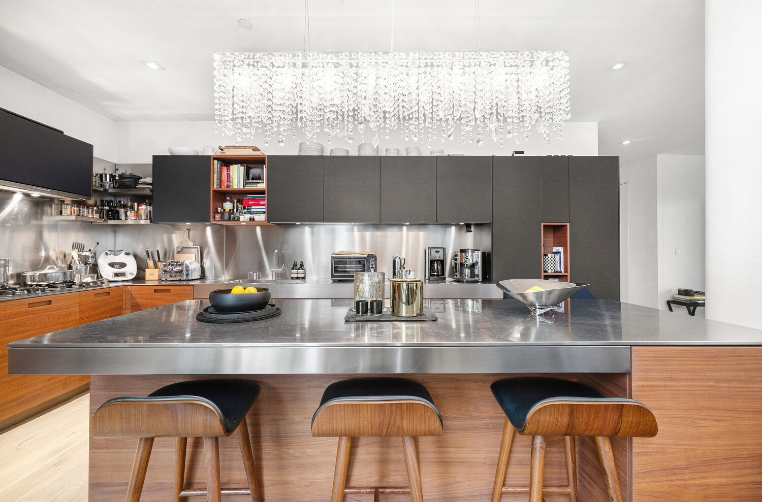 15 Renwick Street, Unit TH3 Manhattan, NY 10013 - Photo 6 of 28 a kitchen with stainless steel appliances granite countertop a sink and cabinets