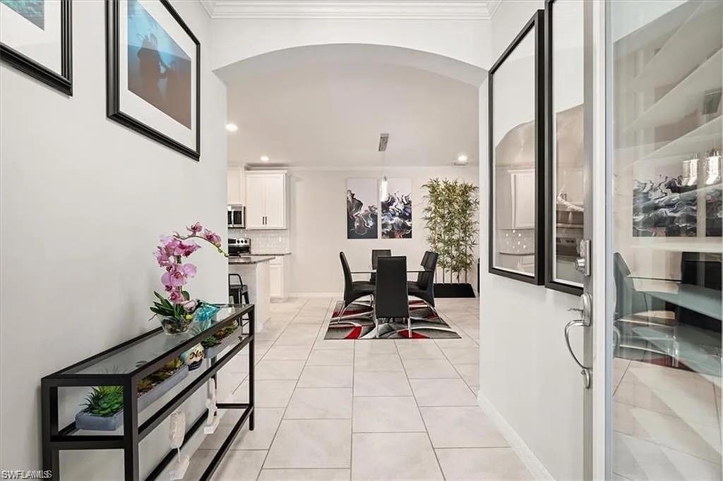 a view of a entryway with furniture and floor to ceiling window