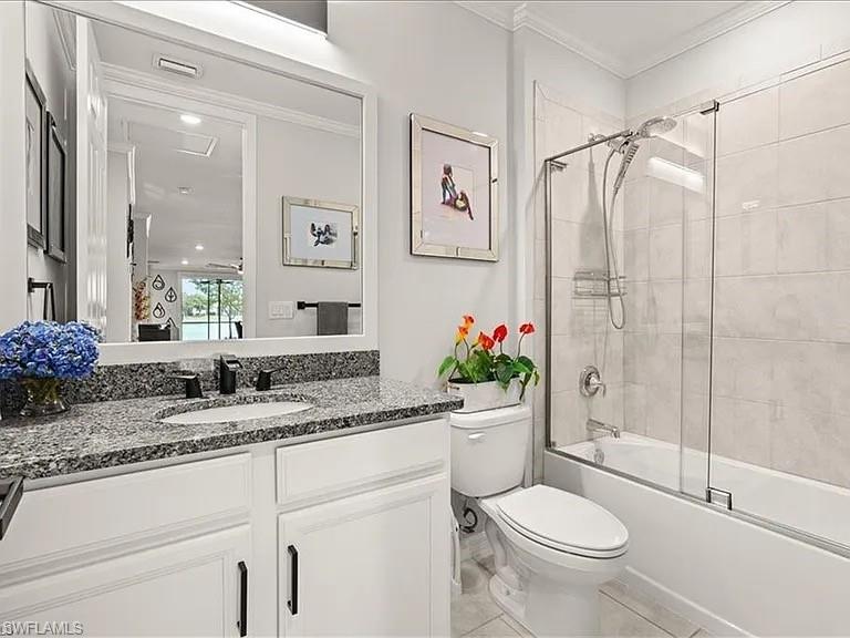 14672 Edgewater Circle Naples, FL 34114 - Photo 15 of 41 a bathroom with a sink toilet and shower