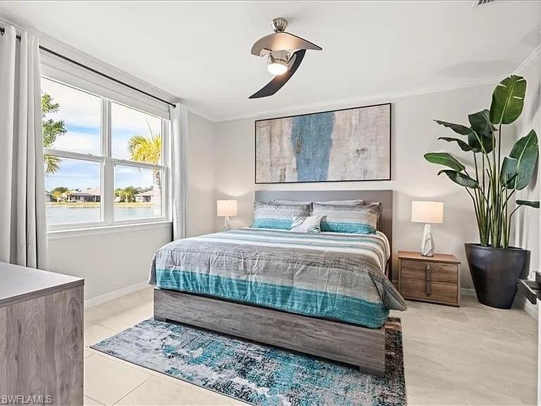 14672 Edgewater Circle Naples, FL 34114 - Photo 16 of 41 a bedroom with a large bed and a potted plant