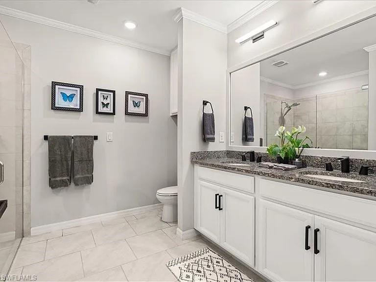 14672 Edgewater Circle Naples, FL 34114 - Photo 19 of 41 a bathroom with a sink a toilet and mirror