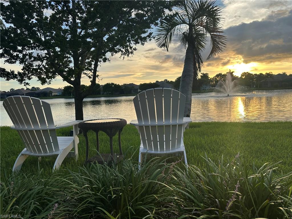 14672 Edgewater Circle Naples, FL 34114 - Photo 23 of 41 a view of a lake with a garden and lake view