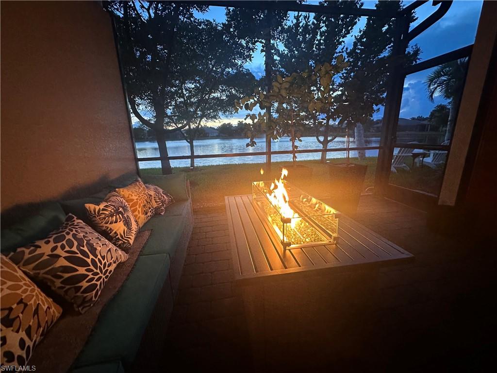 14672 Edgewater Circle Naples, FL 34114 - Photo 24 of 41 a view of a swimming pool with an outdoor seating