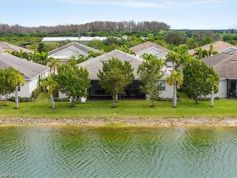 14672 Edgewater Circle Naples, FL 34114 - Photo 28 of 41 a view of a town with mountains in the background