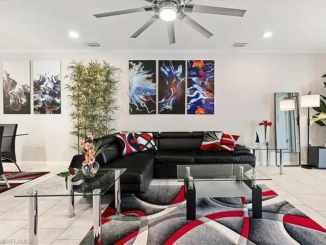 a living room with furniture and musical instruments