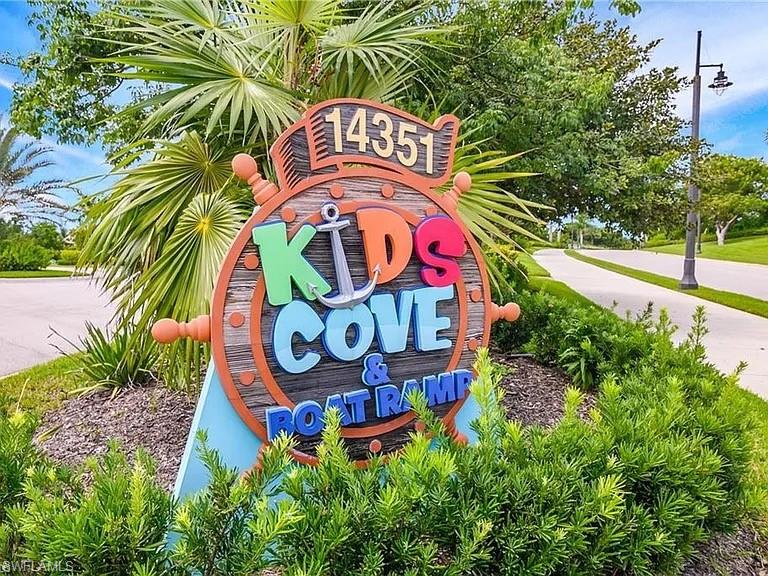 14672 Edgewater Circle Naples, FL 34114 - Photo 31 of 41 a sign that is on the side of the tree