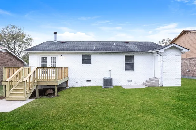 a front view of house with yard and outdoor seating