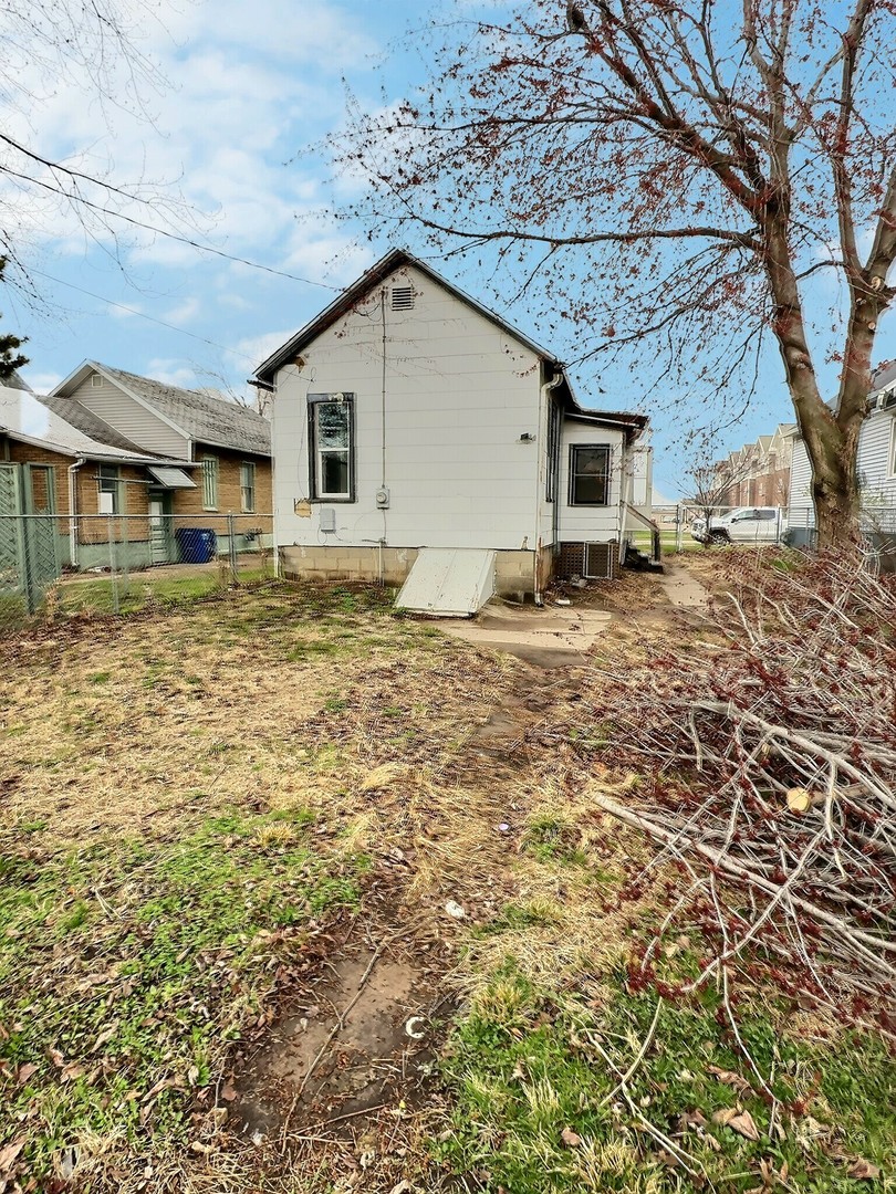 410 North 3rd Street Clinton, IA 52732 - Photo 8 of 8 a house view with a backyard space