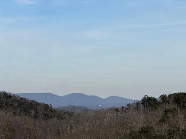 a view of a town with mountains in the background